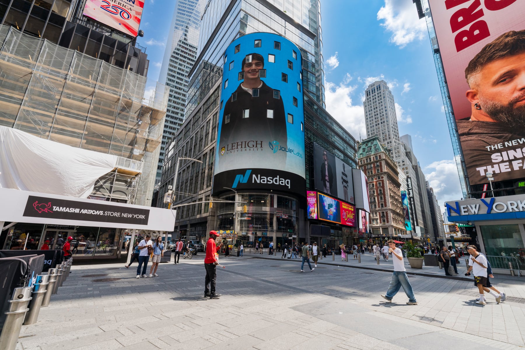 Max featured on the Nasdaq tower screen in Times Square, with the Lehigh University and Joule Labs logos below.