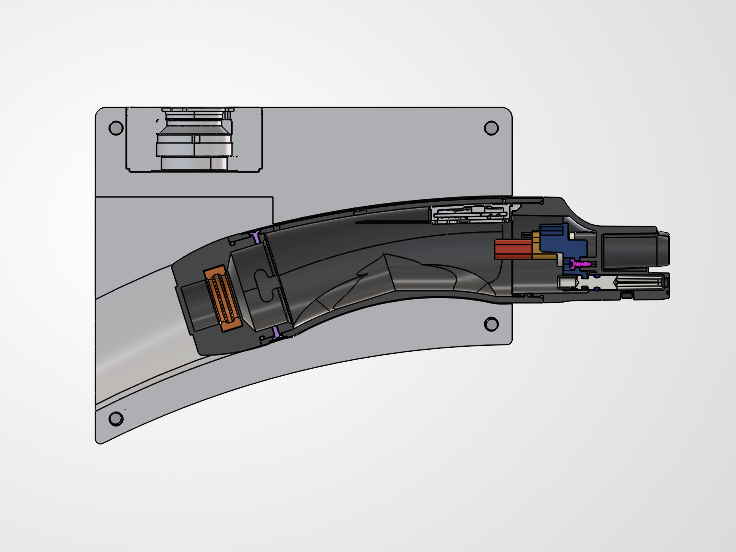 Cross section of the clamshell with the charger seated inside it.